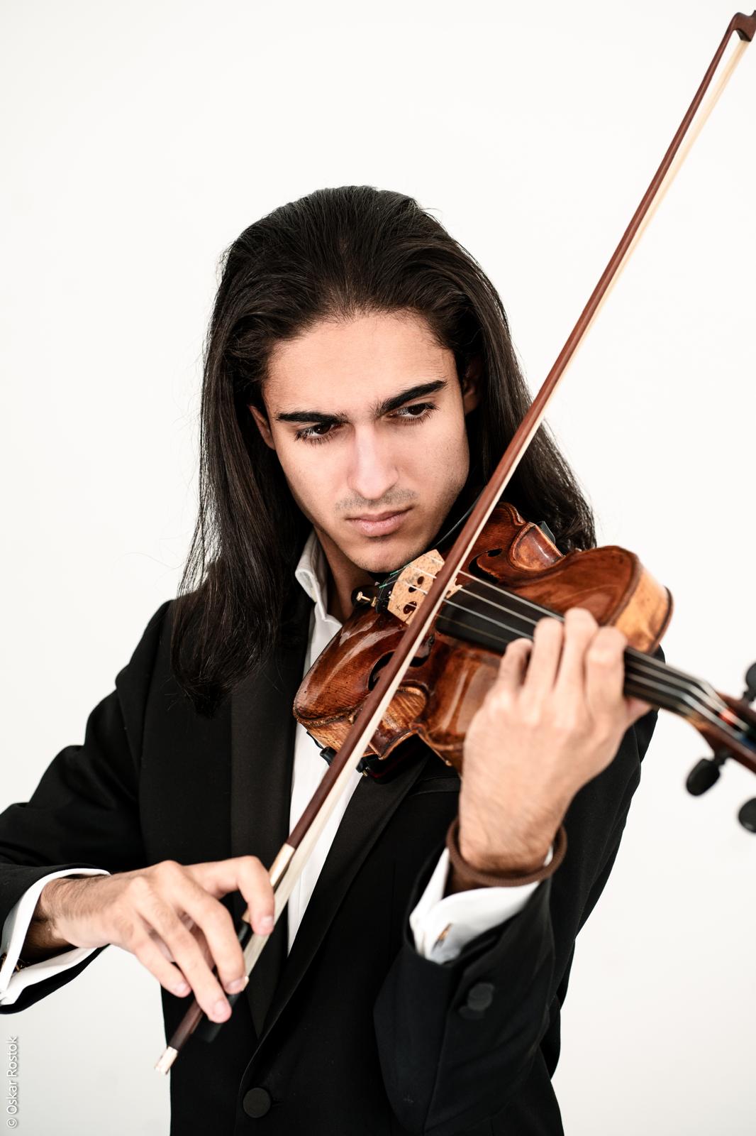 Antonio Piculeață raising the bow, studio portrait
