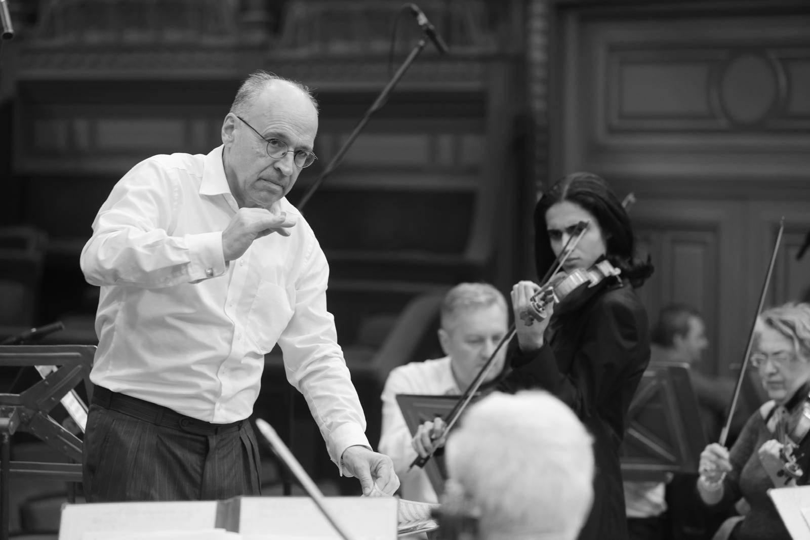 Antonio Piculeață with conductor and orchestra, black and white